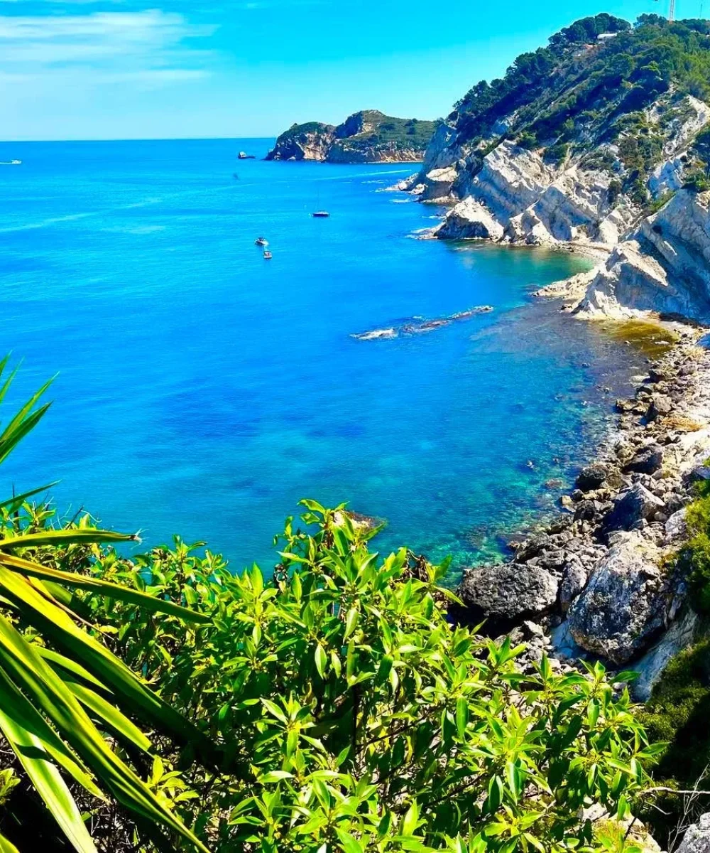 Panoramic views of turquoise coves and cliffs