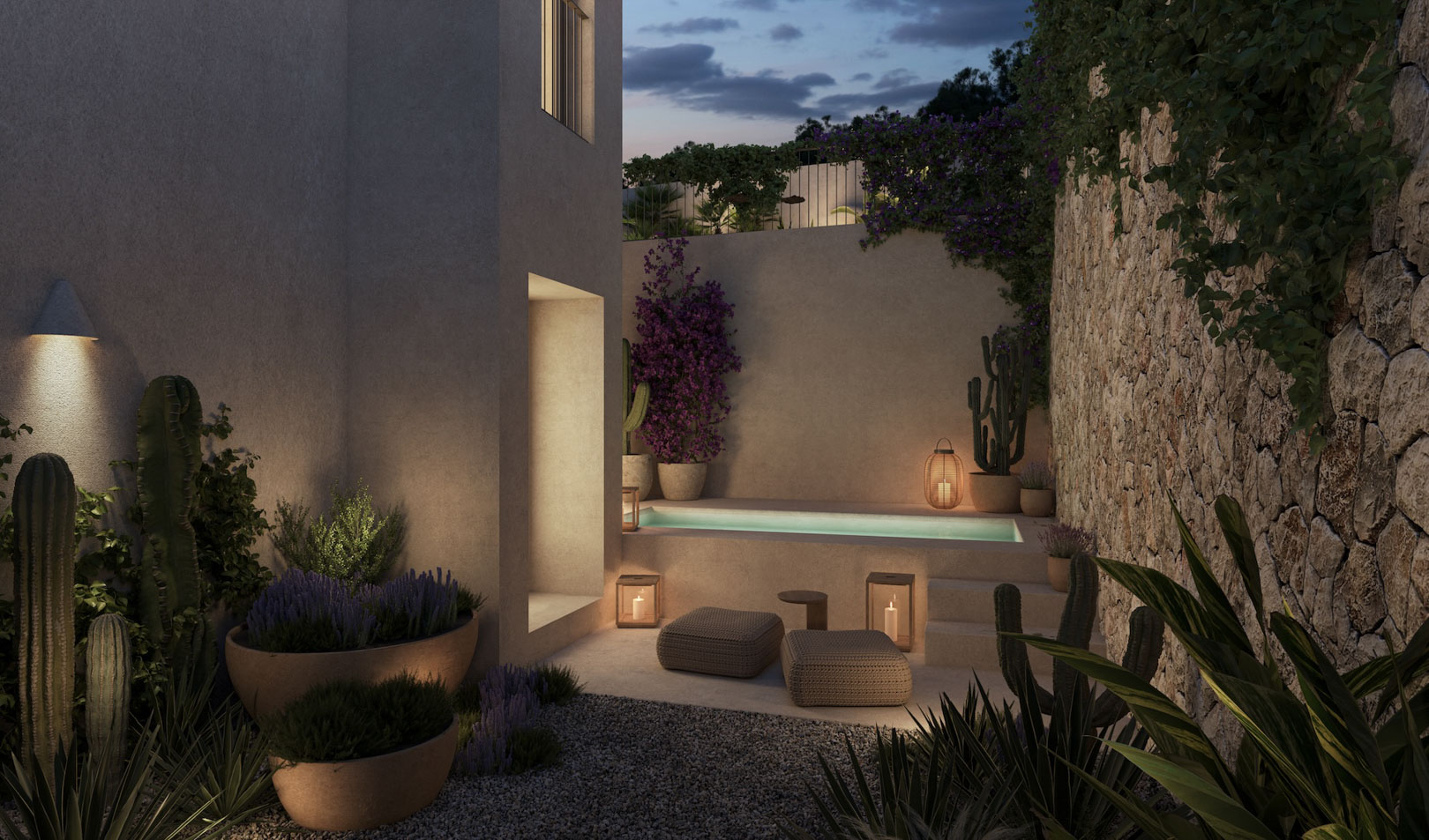 Private outdoor wellness area featuring a plunge pool, natural stone walls, and Mediterranean landscaping with cacti and integrated evening lighting.