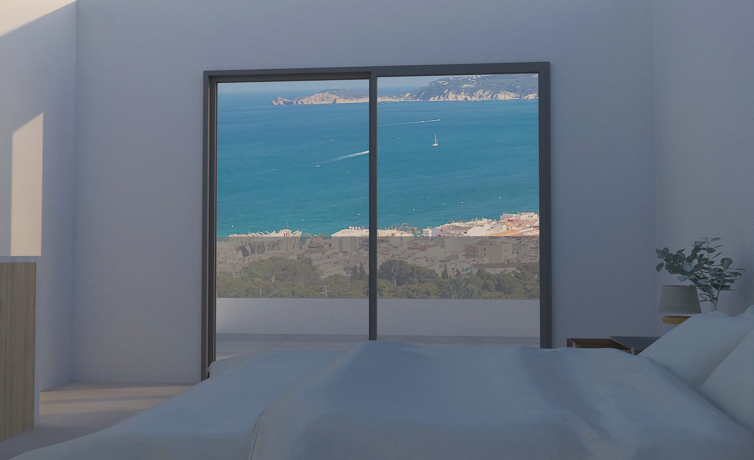 Bedroom featuring large sliding glass doors that frame expansive views of the Mediterranean Sea and the coastline of Jávea.