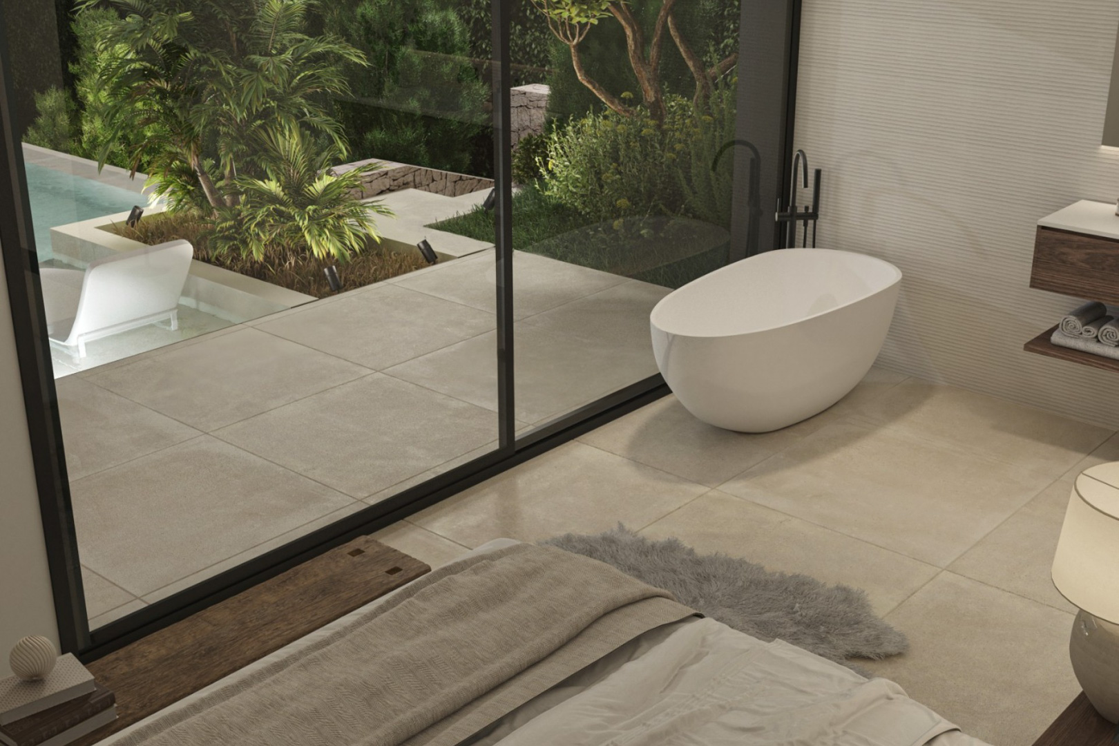 Master suite featuring a freestanding oval bathtub and floor-to-ceiling glass doors opening onto a private terrace with garden and pool views.