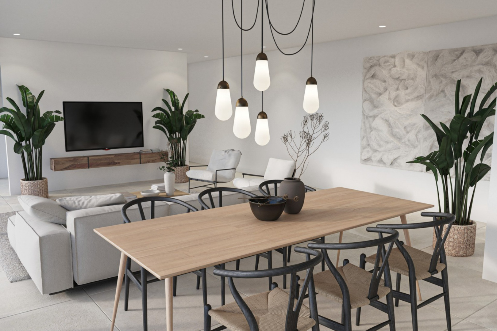 Open-concept dining and living space featuring a light wood table, black Wishbone-style chairs, and a modern cluster pendant light against a minimalist white backdrop.