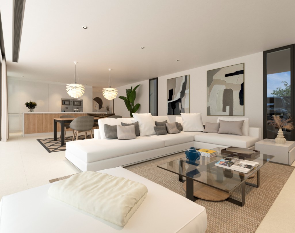 Open-concept living area featuring a large white sectional sofa, glass coffee table, and an integrated dining space leading to a modern kitchen.