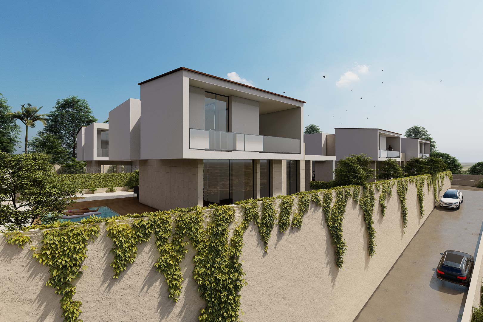 Exterior view of modern villas featuring glass-railed balconies and high perimeter walls with climbing ivy. The architecture showcases clean lines and a minimalist white aesthetic.