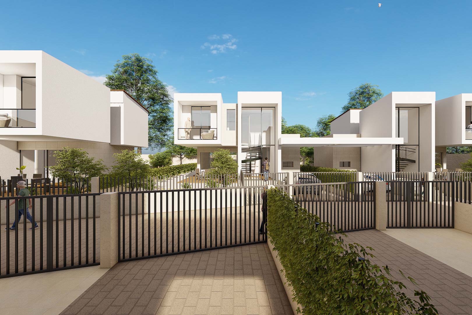 Exterior view of modern white villas featuring cubic architecture, large glass panels, and black metal fencing. Paved driveways lead to these contemporary two-story residences.