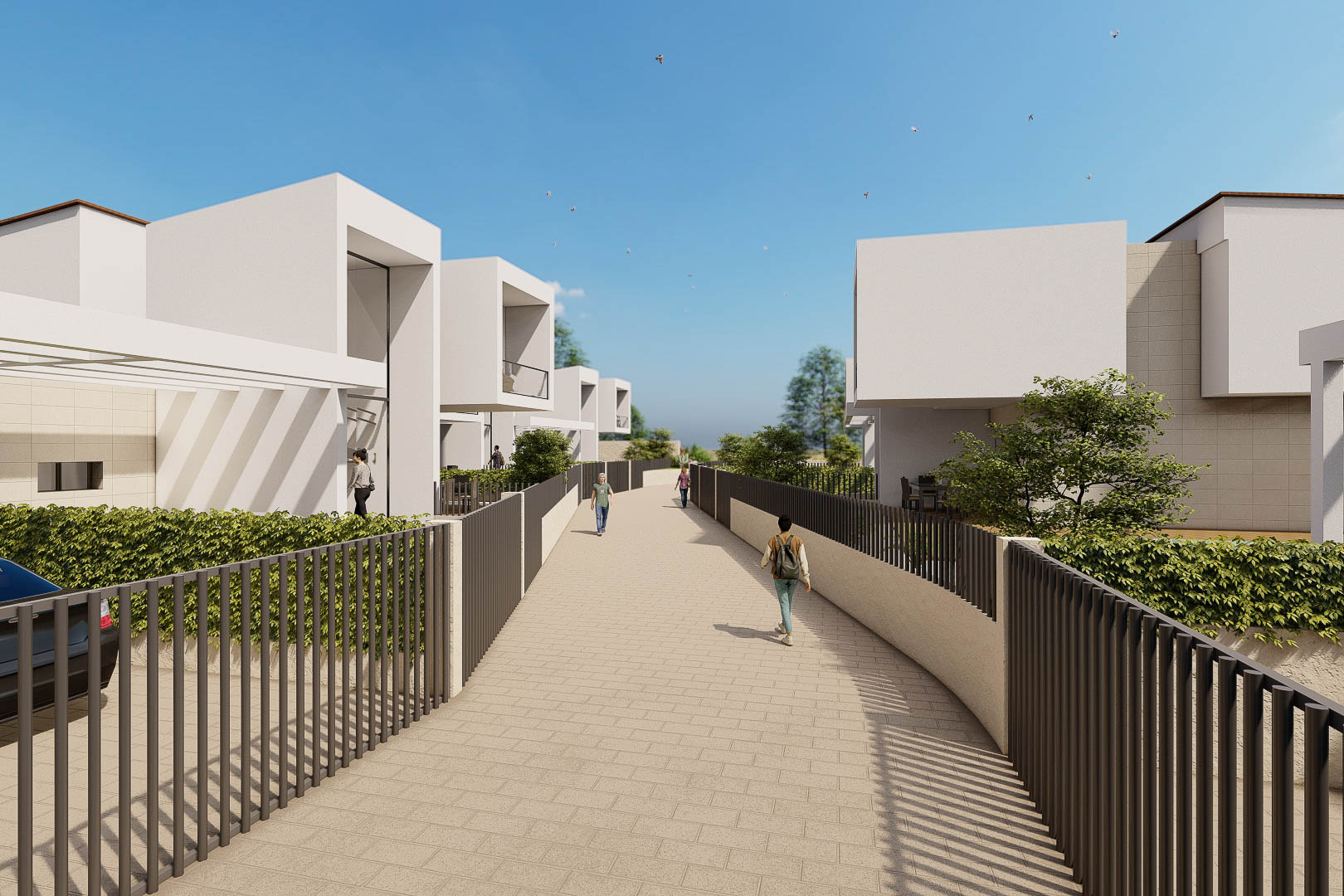 Exterior view of the complex featuring minimalist white villas, dark vertical fencing, and a paved access path under a clear blue sky.