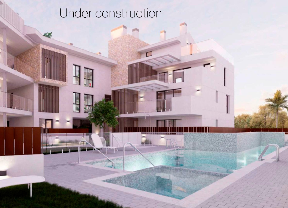 Exterior view featuring the communal swimming pool area, white building facades with stone accents, glass railings, and integrated wooden privacy slats.