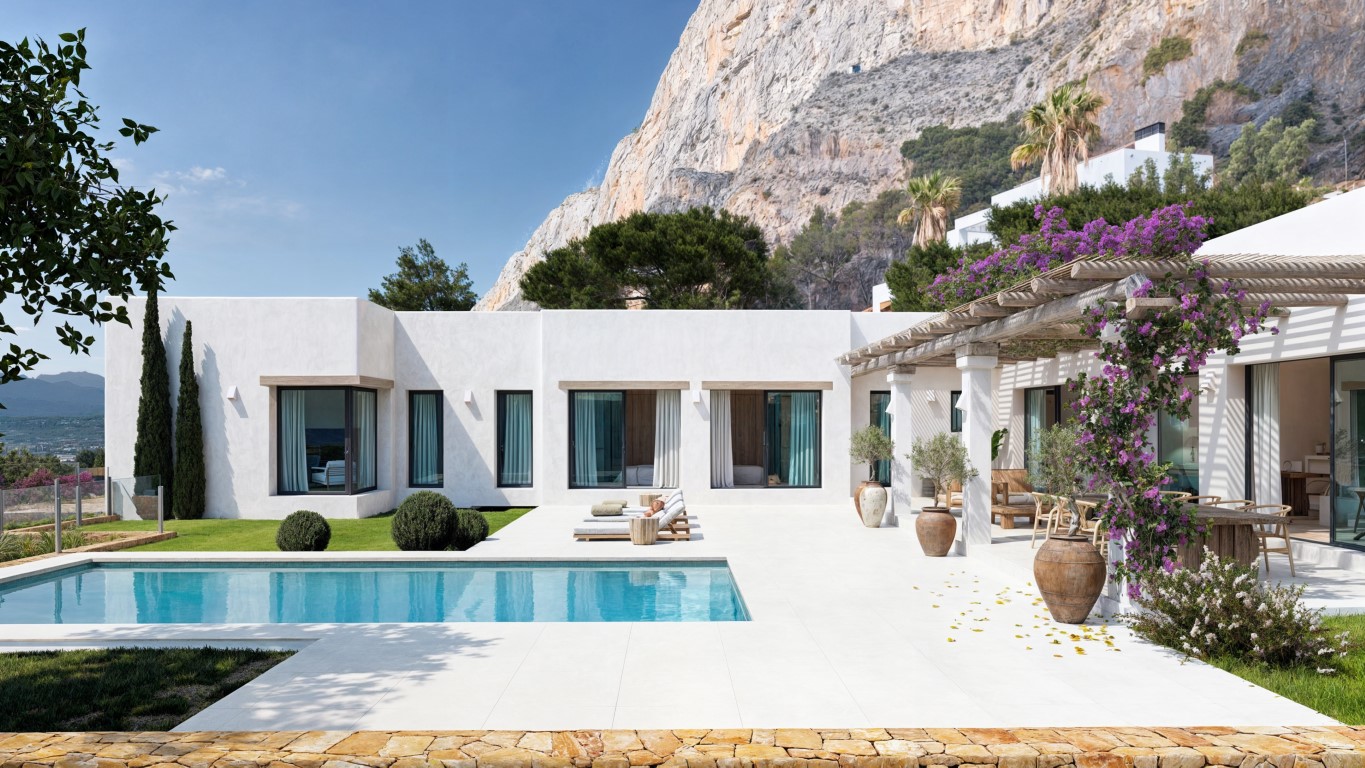 Exterior view featuring a rectangular pool, white tiled terrace, and wooden pergola with bougainvillea, set against the dramatic Montgó mountain cliffs.