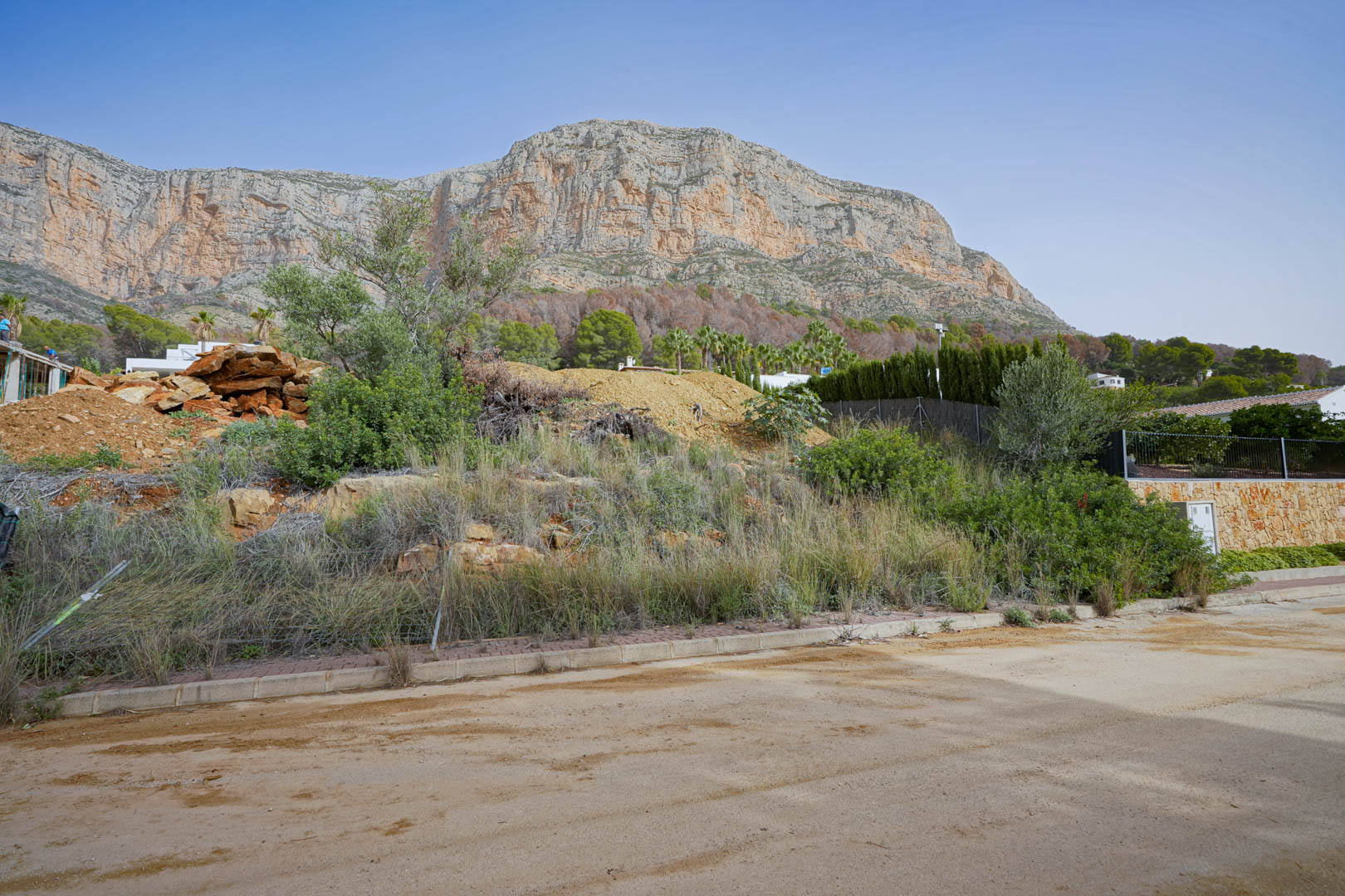 View of the Montgó massif from the construction plot, featuring the impressive limestone cliffs that define the northern landscape.
