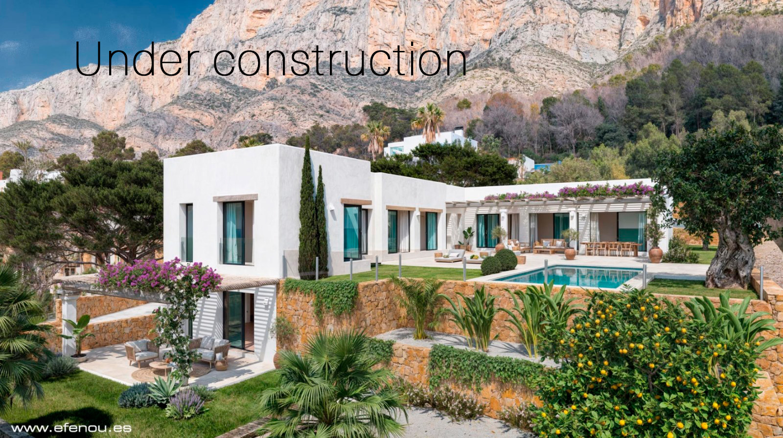 Villa exterior featuring white architecture, a private pool, and stone-walled terraces with pergolas, set against the steep limestone cliffs of Montgó.