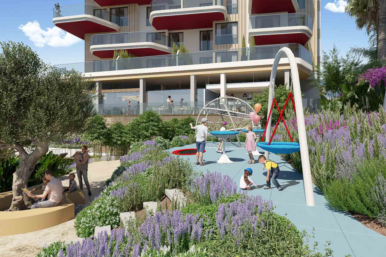 Children's playground with blue safety flooring and modern structures, nestled within landscaped gardens featuring lavender and olive trees by the main building.