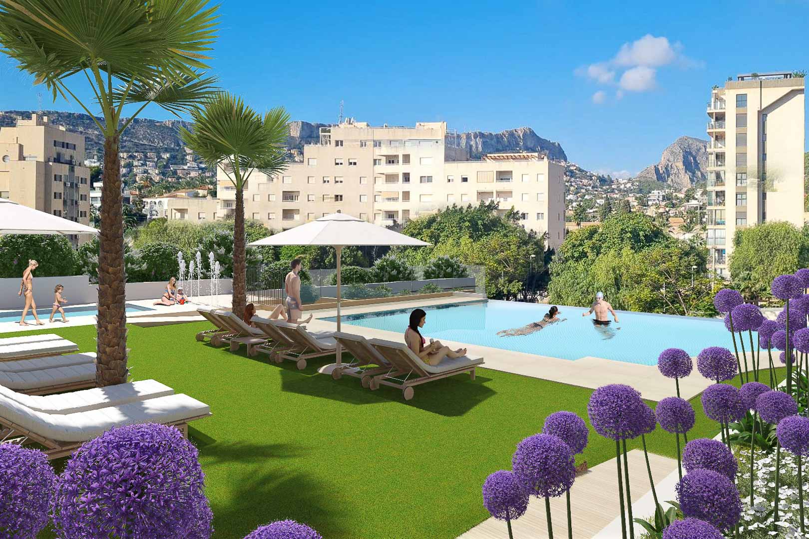 Infinity pool area with a sun deck, loungers, and landscaped gardens featuring palm trees and views of Calpe's skyline and mountains.