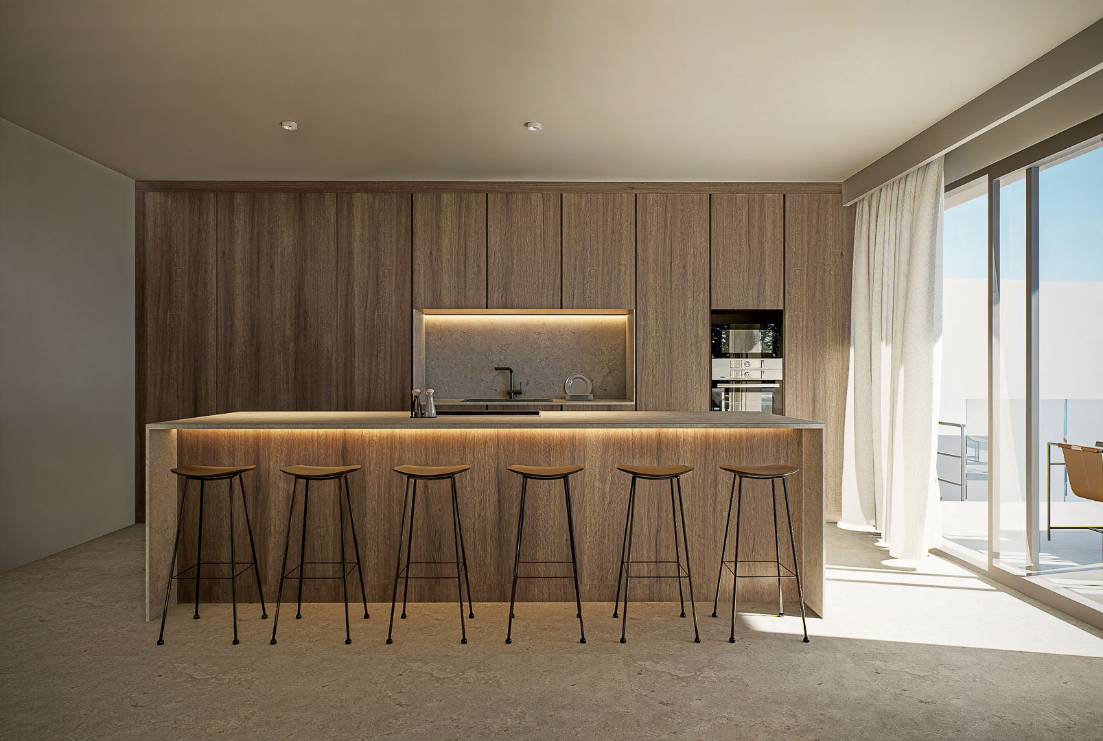 Designer kitchen featuring a stone island with integrated LED lighting, minimalist bar stools, and floor-to-ceiling wood cabinetry with a recessed workspace.