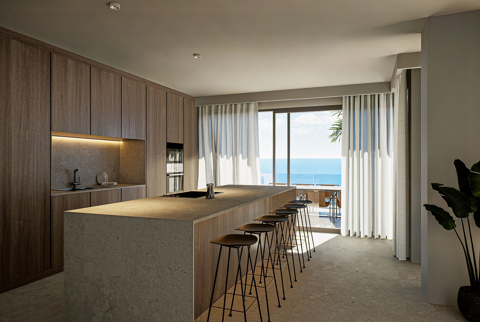 Designer kitchen featuring a stone waterfall island, natural wood cabinetry, and floor-to-ceiling windows offering expansive views of the Mediterranean Sea.