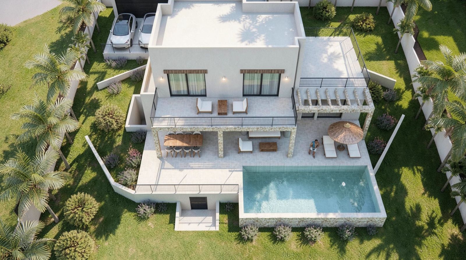 Aerial view of the modern villa featuring a turquoise pool, stone-clad terrace with outdoor dining, landscaped garden with palms, and private parking.