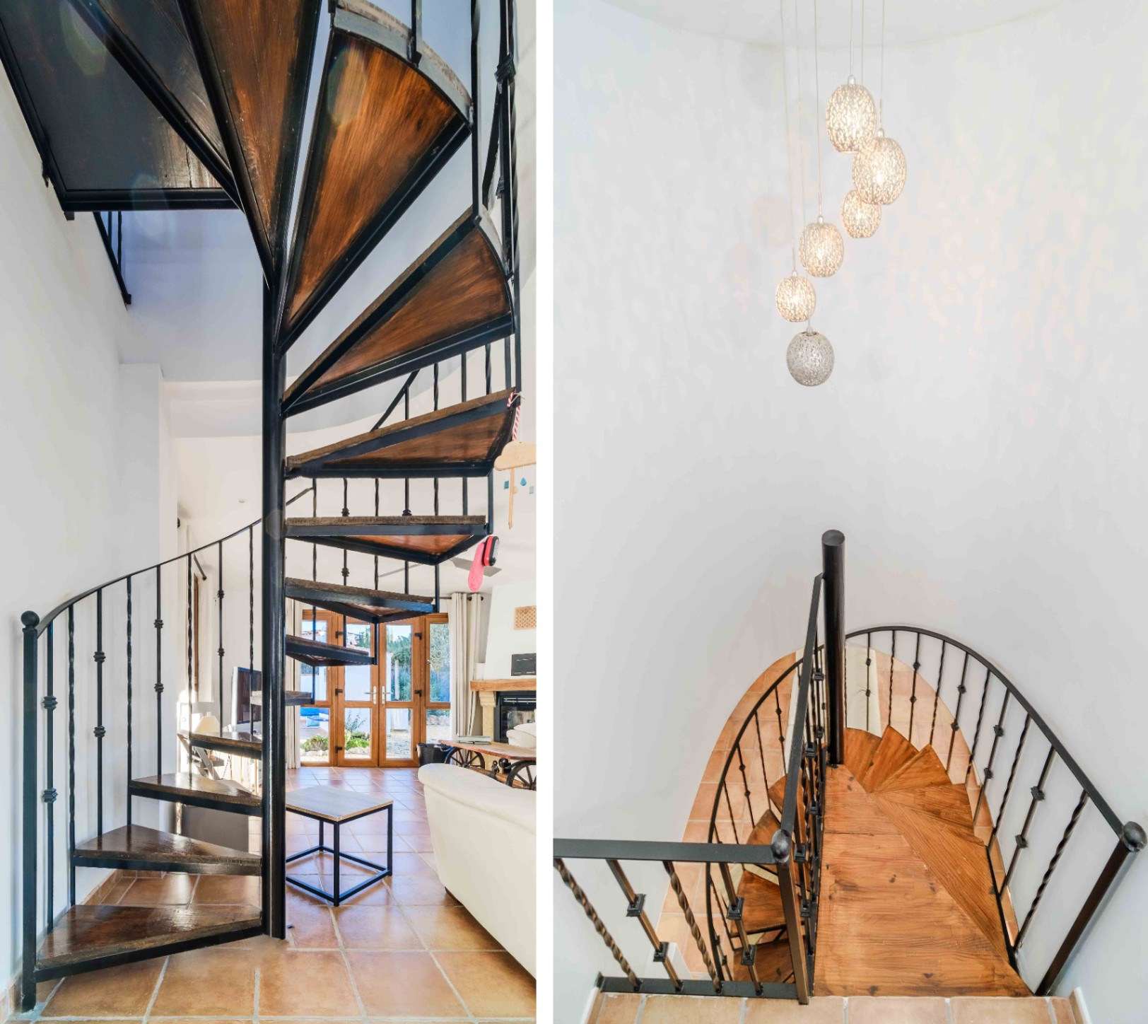 Spiral staircase featuring wooden treads and a black metal railing, complemented by a modern multi-globe pendant light and traditional terracotta flooring.