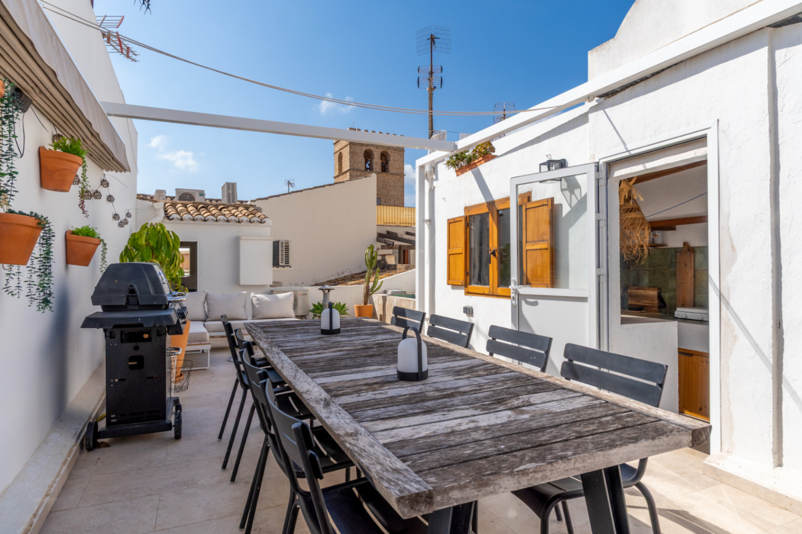 Terrace with outdoor dining, barbecue, and views of Jávea's old town.