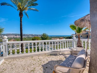 Terrace with panoramic views, white balustrade railing, and gravel ground. Ideal for outdoor relaxation.