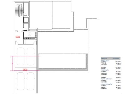 Detailed architectural plan of the ground floor featuring a double garage, staircase, and space distribution.