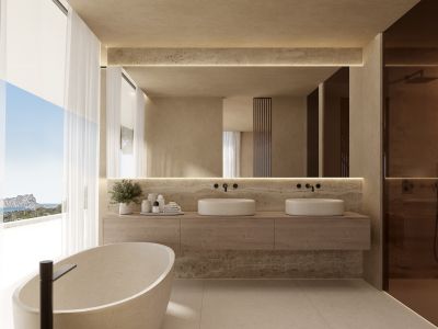 Master bathroom featuring a freestanding stone tub, double vessel sinks, and panoramic sea views through expansive windows.