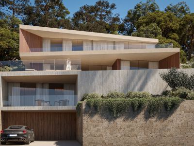 Modern multi-level villa featuring light concrete, wood accents, and glass-railed terraces, nestled into a green hillside with a private garage.
