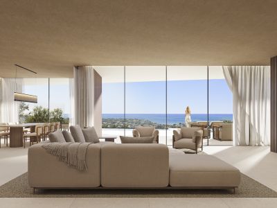 Open-plan living and dining area with a modular sofa, floor-to-ceiling windows offering sea views, and a wooden dining table.