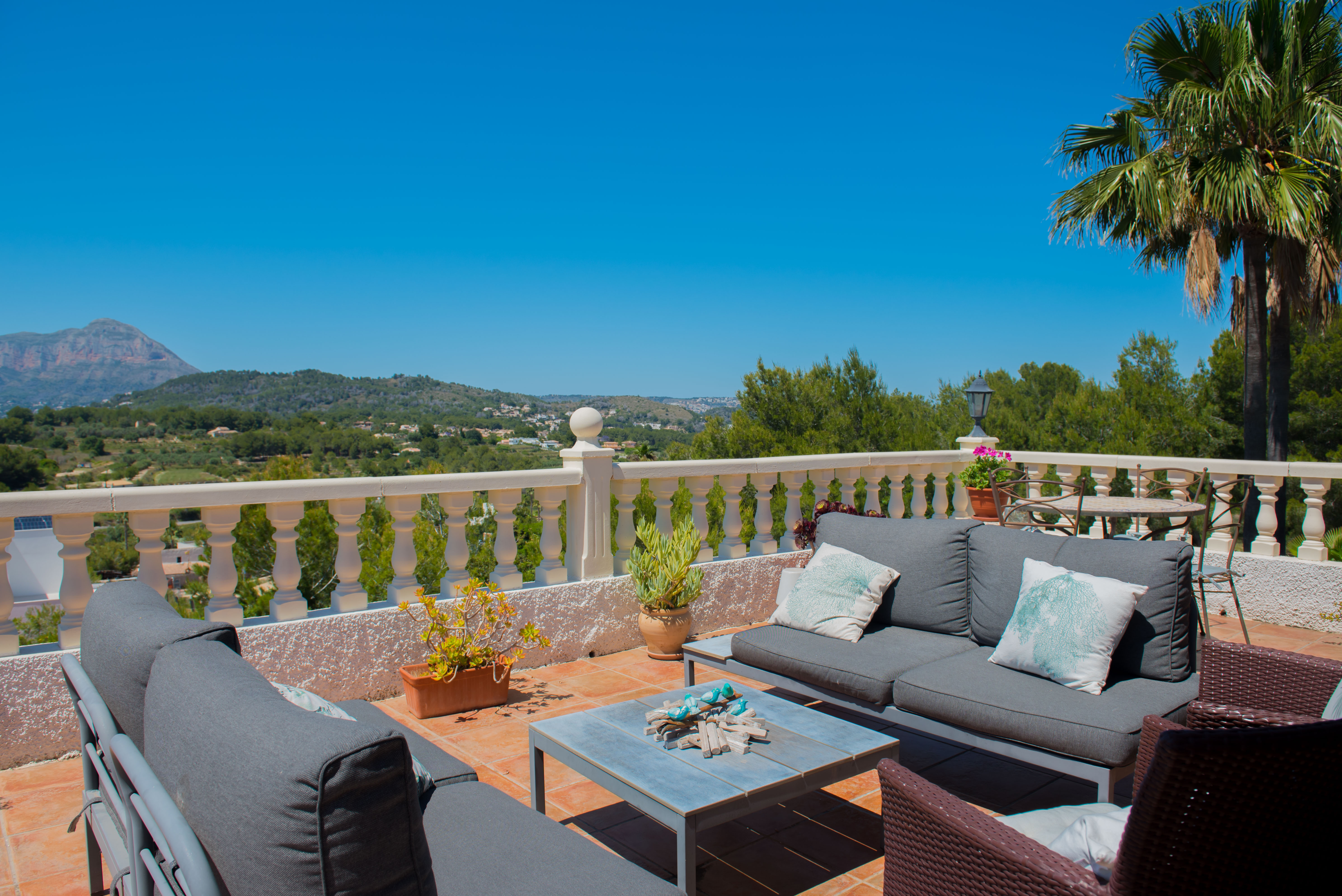 Terrace with balcony and mountain views.