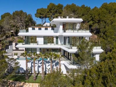 Contemporary multi-level villa featuring a pristine white facade, expansive glass terraces, a swimming pool with palm trees, and an outdoor kitchen, integrated into a lush green hillside.