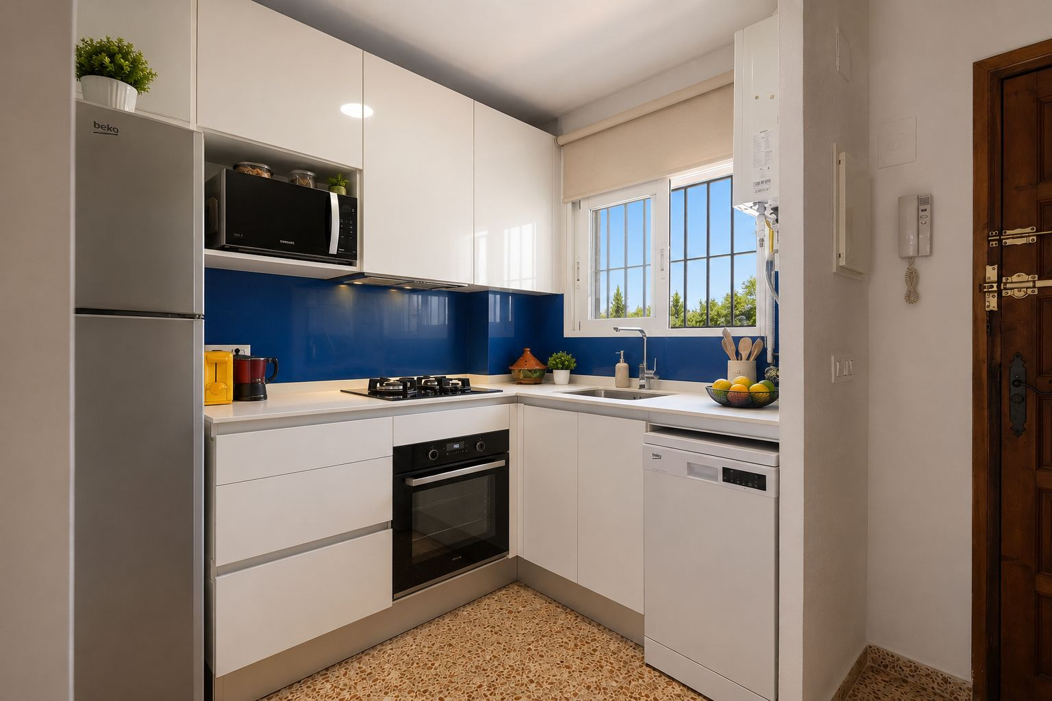 Modern and functional kitchen featuring glossy white cabinetry, a light countertop, and a vibrant blue backsplash. Equipped with integrated appliances and a window overlooking greenery.