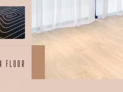 Detailed view of the underfloor heating system, paired with light wood flooring and sheer white curtains.