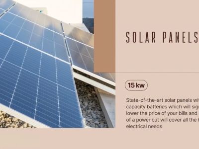 Exterior view of the villa's 15 kW solar panel system, mounted on a gravel base, ensuring high energy efficiency and reduced consumption.