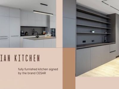 Modern CESAR designer kitchen, featuring a light grey island with integrated sink, complemented by a darker grey wall unit with open shelving and high-end appliances.