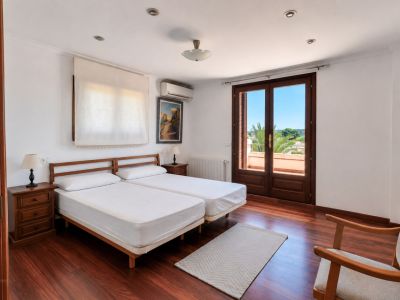 Bedroom with balcony access