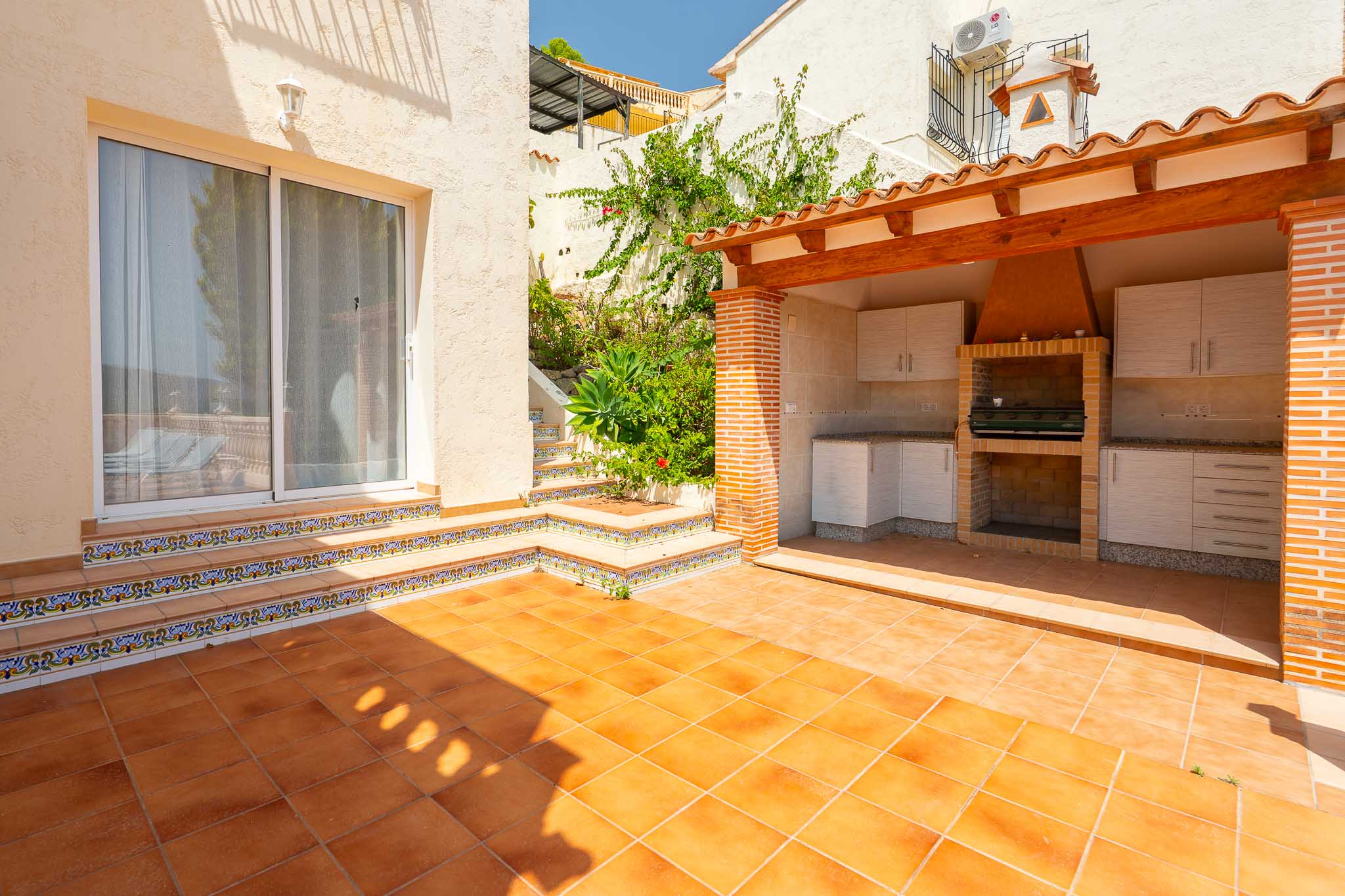 Terrace with outdoor summer kitchen