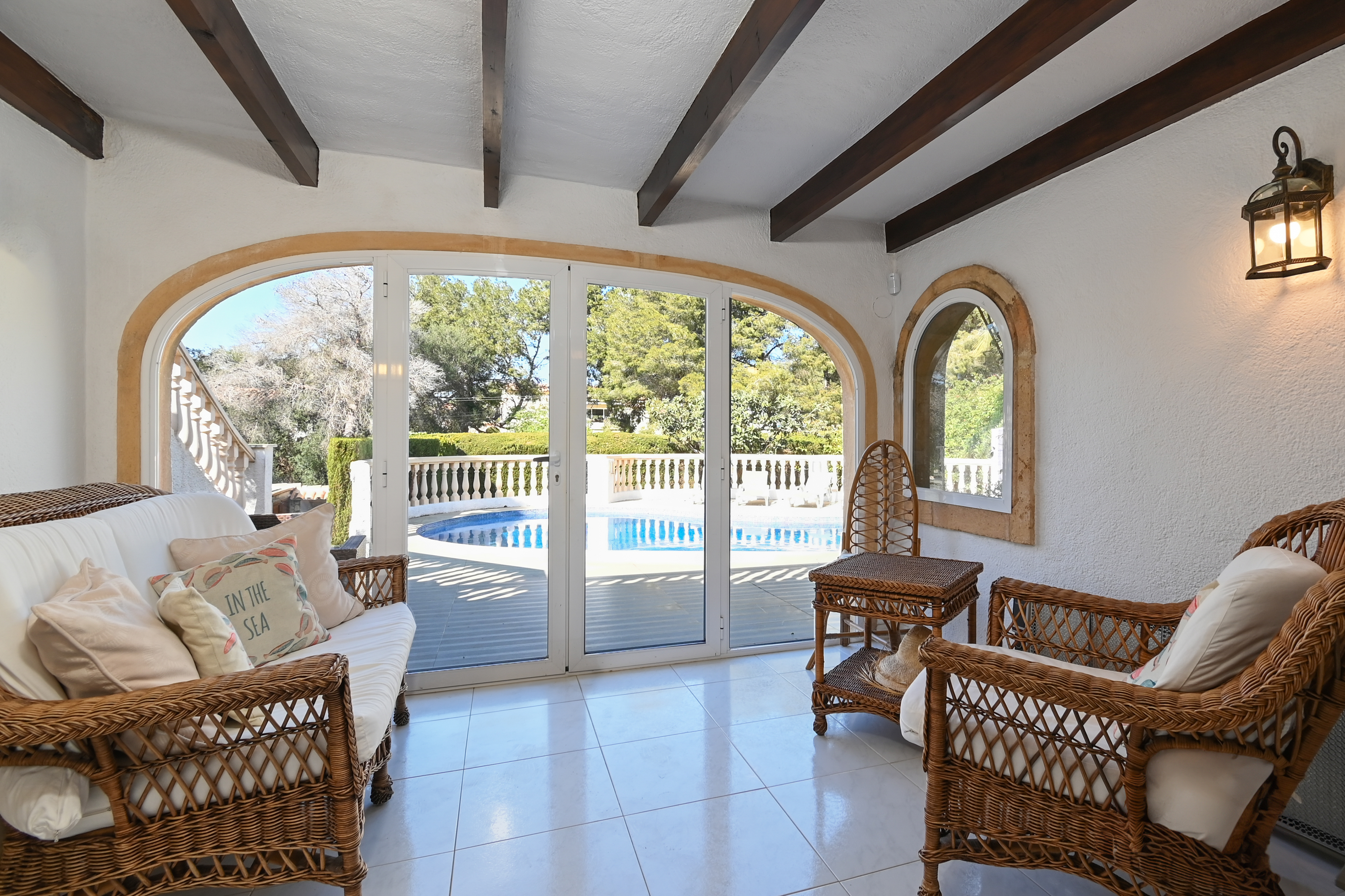 Glazed porch with pool view