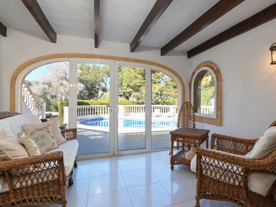 Glazed porch with pool view