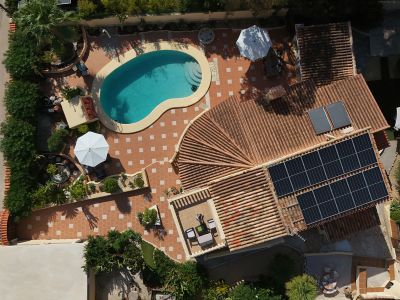 Aerial view of property and pool