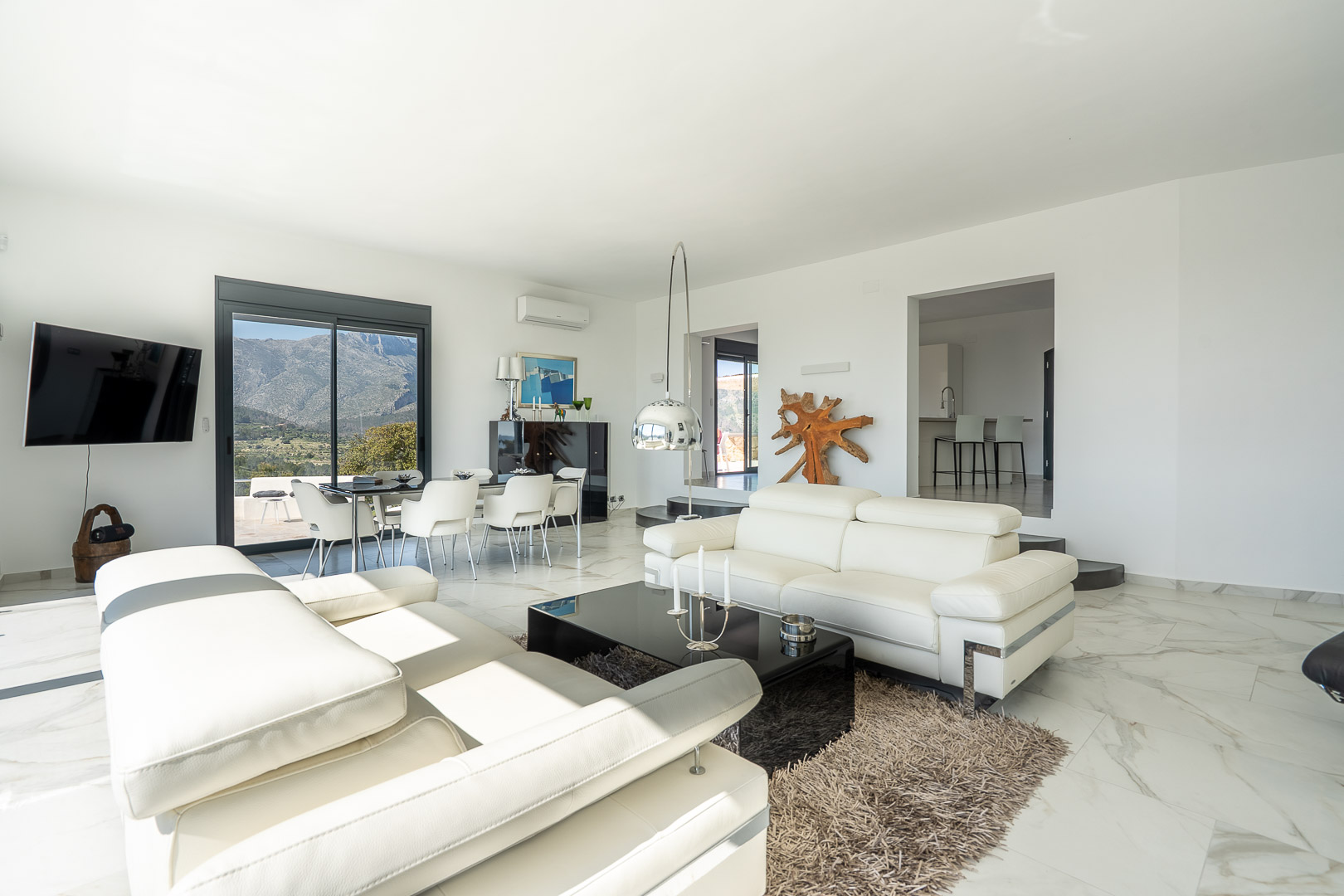 Living and dining room with mountain views