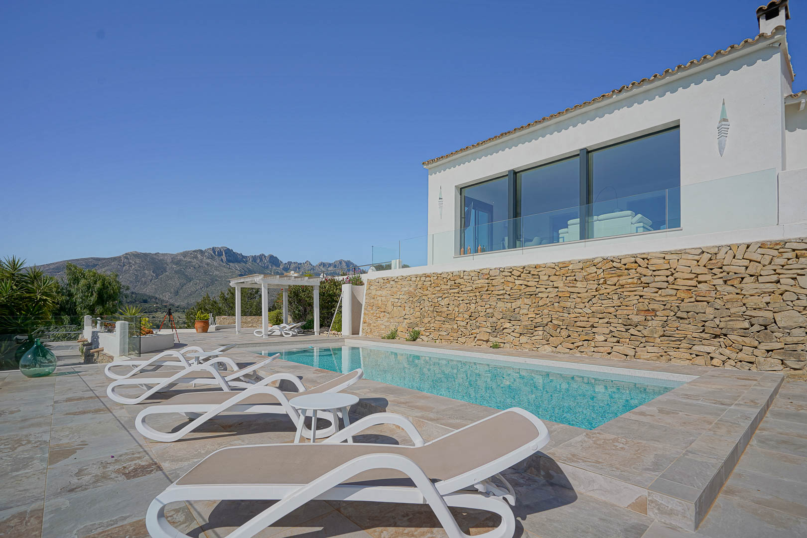 Pool and terrace with mountain views