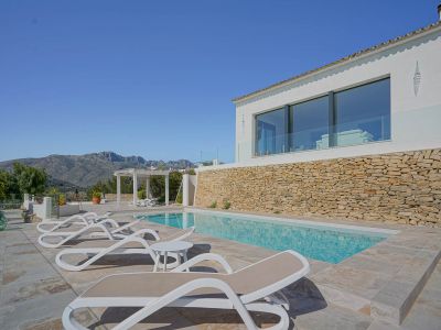 Pool and terrace with mountain views