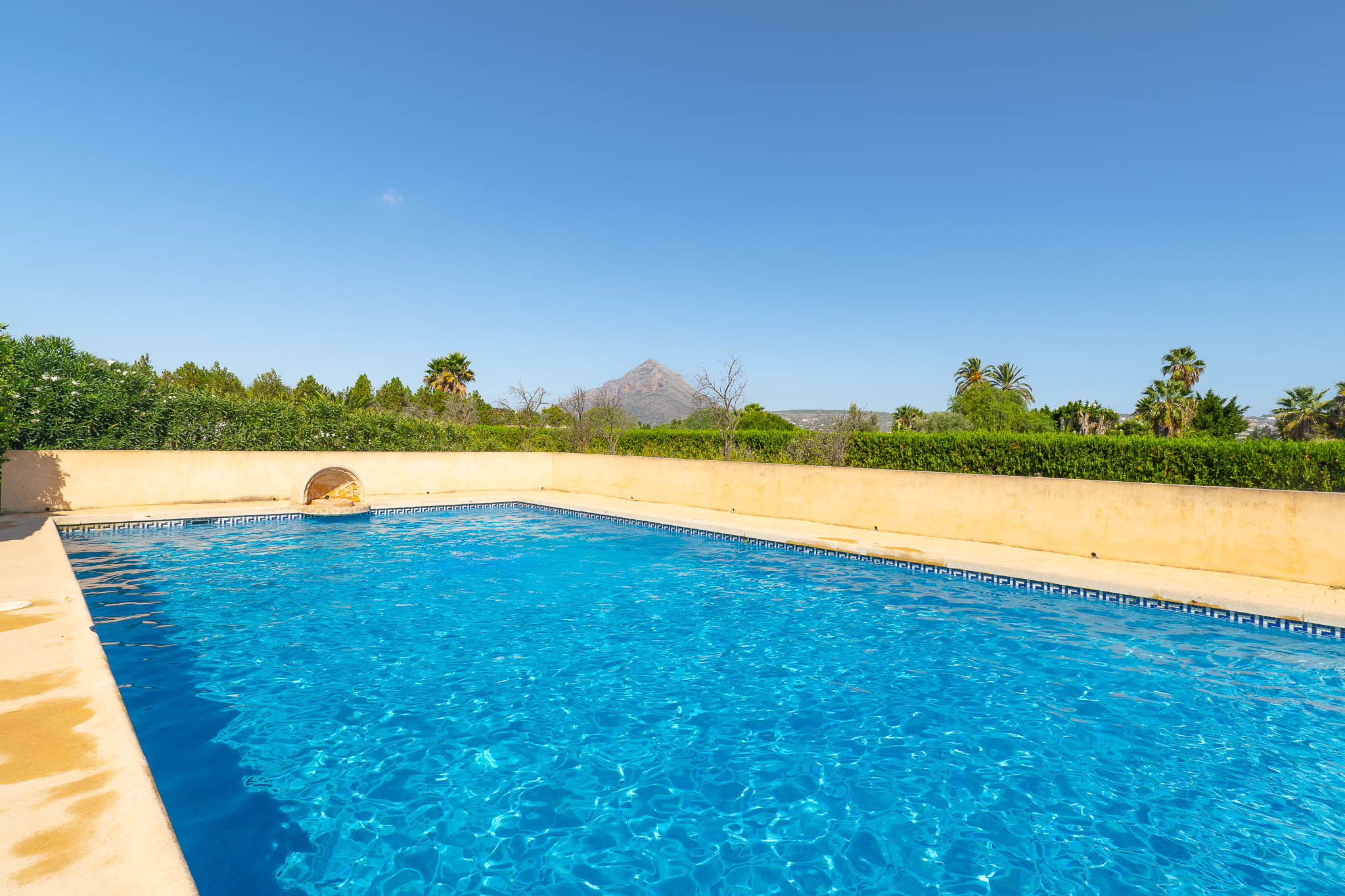 Communal pool with mountain views