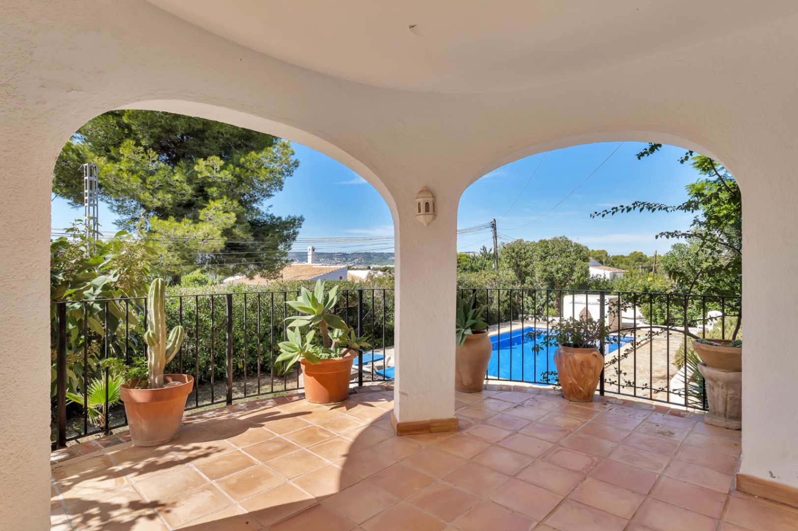 Covered terrace overlooking the pool
