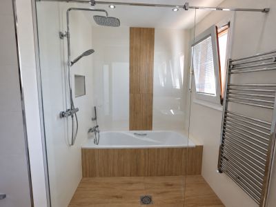 Bathroom with bathtub and shower