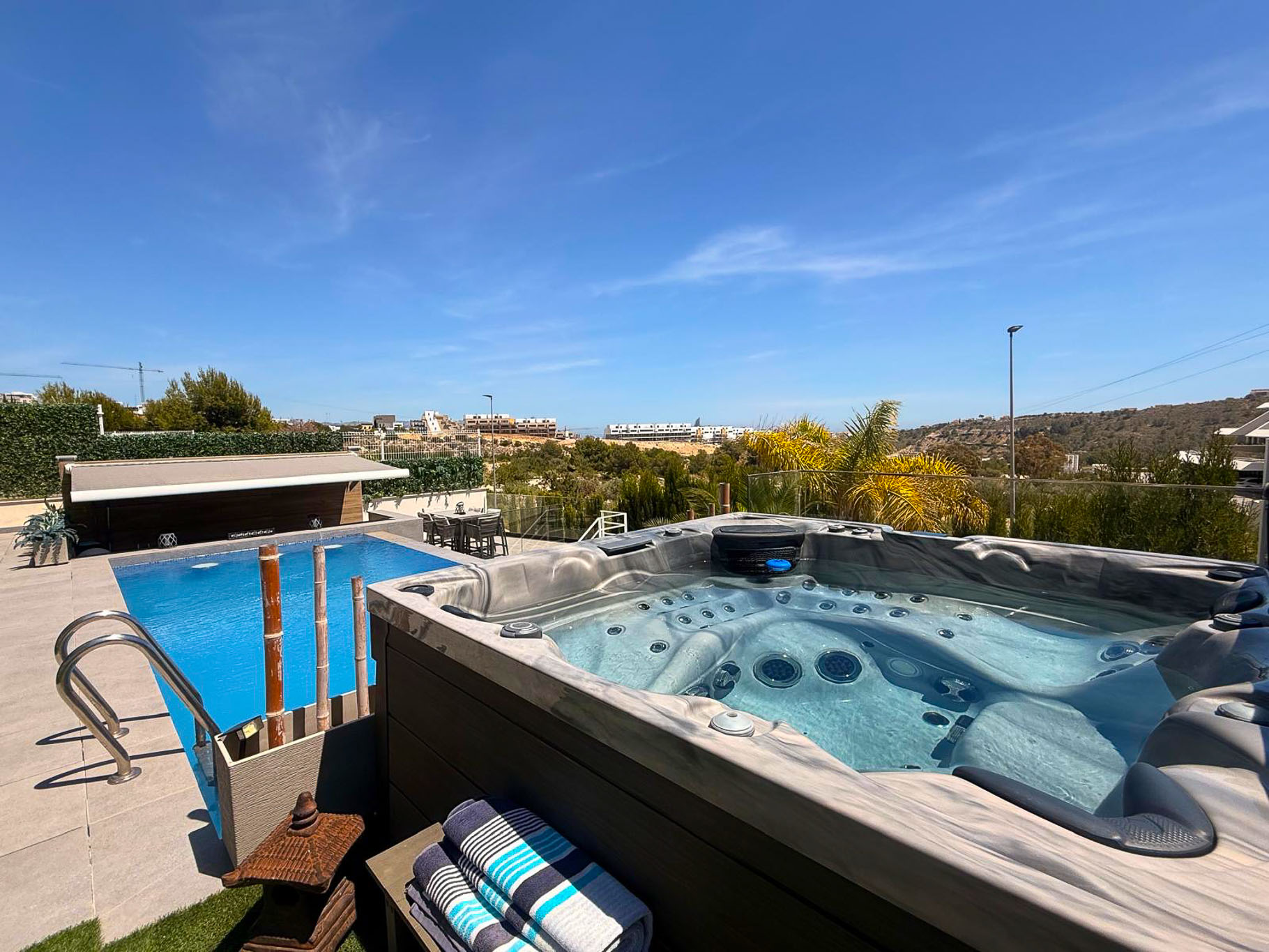 Terrace with jacuzzi and pool