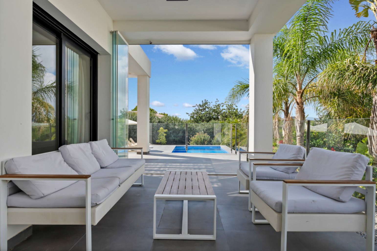 Covered terrace with pool view