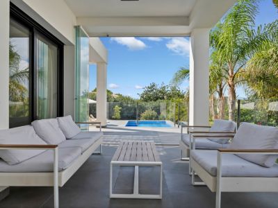 Covered terrace with pool view