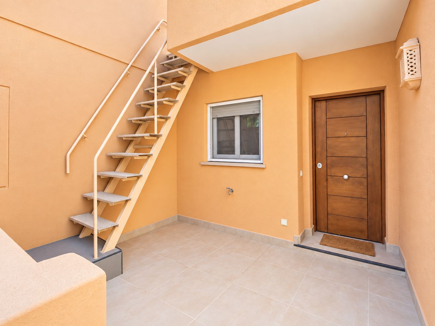Entrance with exterior stairs