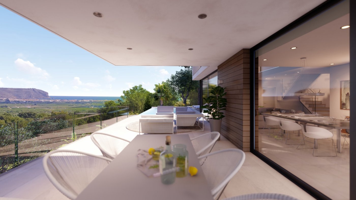 Covered terrace with outdoor dining and lounge areas, featuring glass railings and panoramic views of the valley and coastline.