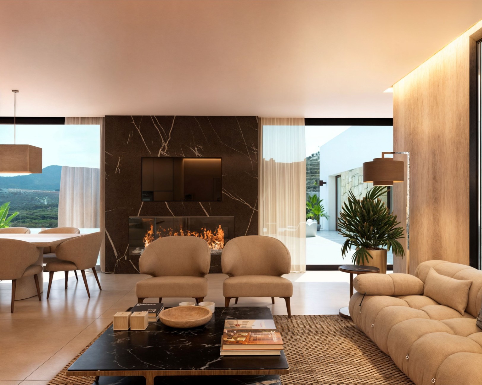 Modern living area featuring a dark marble fireplace wall, integrated television, and floor-to-ceiling windows with views of the mountain landscape.