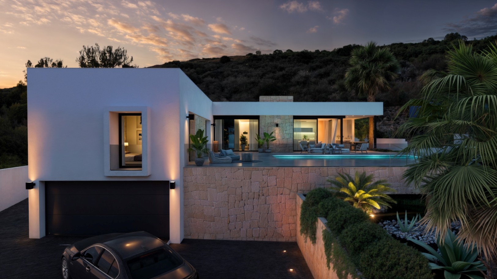 Modern two-level villa featuring a white facade, stone retaining walls, and an infinity pool. Integrated exterior lighting illuminates the driveway and upper terrace at dusk.