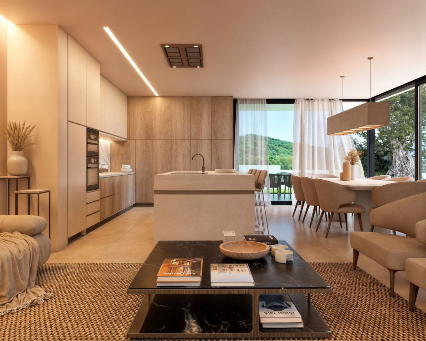 Open-plan living space featuring a minimalist kitchen with wood cabinetry, a central stone island, and a dining area overlooking green hills through floor-to-ceiling windows.